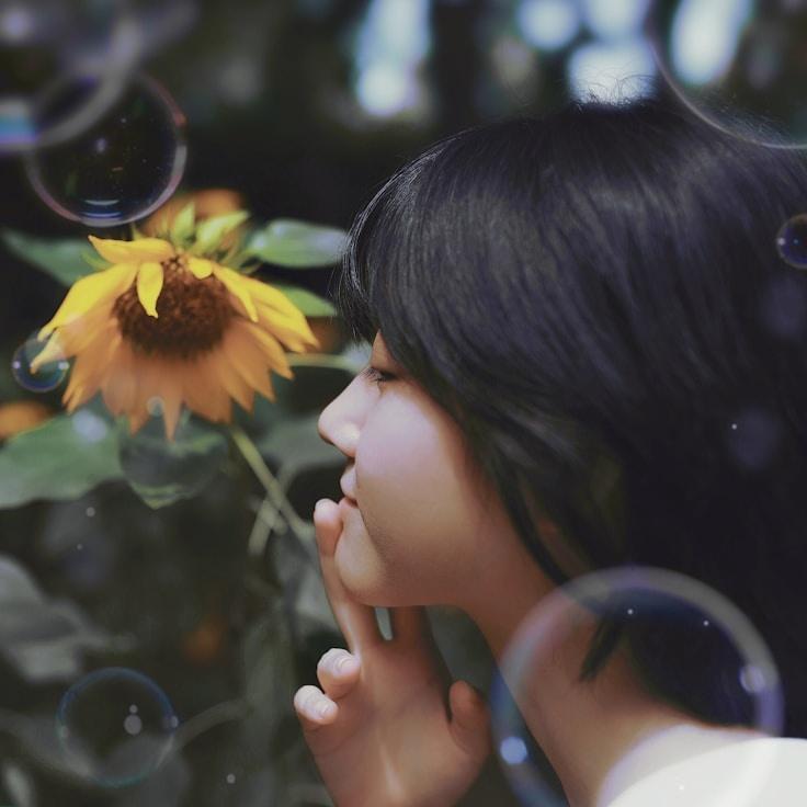 Aisha Rao, Lead Design Curator at HarborCrestStudio, reviewing corporate floral arrangements